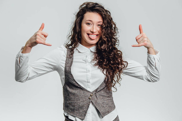 Portrait of attractive business woman on white background. With plenty of copy space. With a beautiful curly hair. - Foto, Imagen