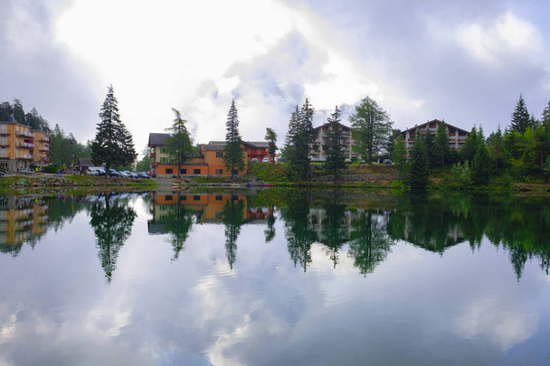 reflection of typical Swiss landscape in a lake - Photo, Image