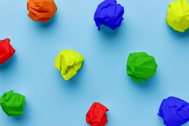 colorful crumpled pieces of paper. on blue background - Foto, immagini
