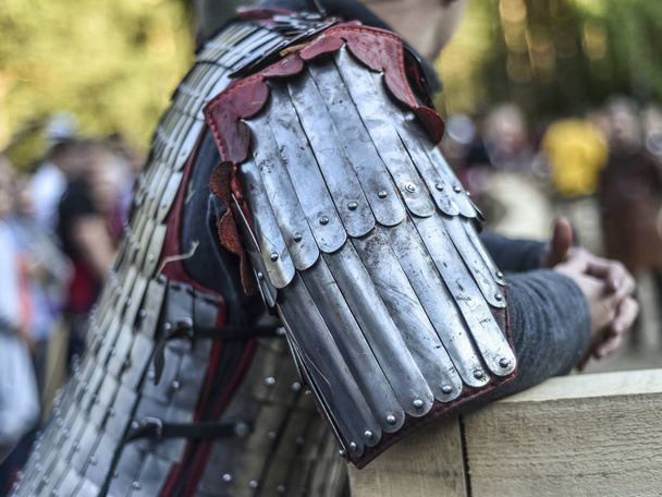 Beautiful art objects. Beautiful background, view, landscape, panorama of the reconstruction of the knightly tournament, metal armor dressed on a knight on a summer day in nature. - Foto, imagen