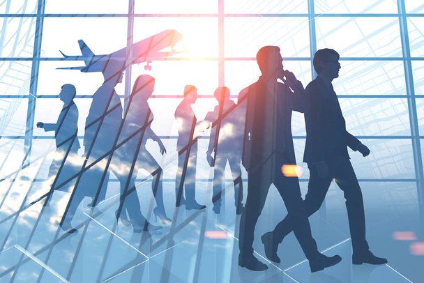 Silhouettes of business people walking in airport with plane taking off. Concept of business trip. Toned image double exposure - Photo, Image