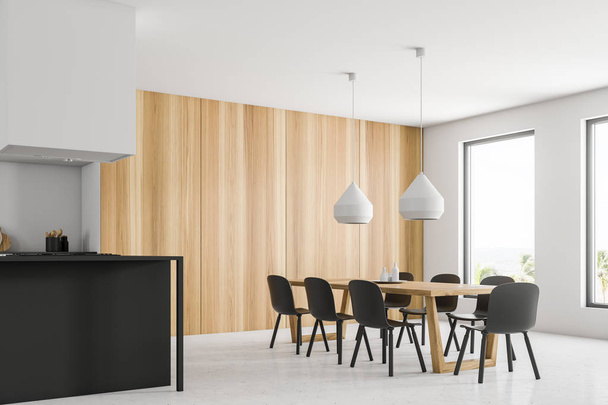 Corner of stylish kitchen with white walls, stone floor, white countertops, wooden cupboard, gray island and long wooden table with gray chairs. 3d rendering - Fotó, kép