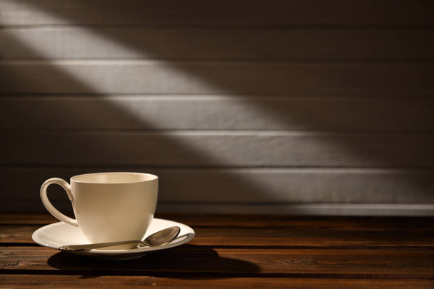 Coffee cup on old wooden background - Foto, afbeelding