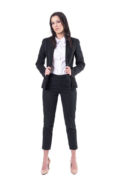 Serious confident business woman in formal style fashion posing and looking at camera. Full body isolated on white background.  - Фото, зображення