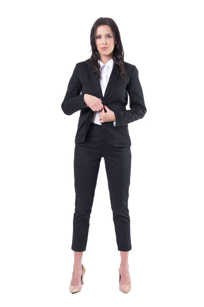 Serious confident business woman getting dressed in formal clothes. Full body isolated on white background.  - Zdjęcie, obraz