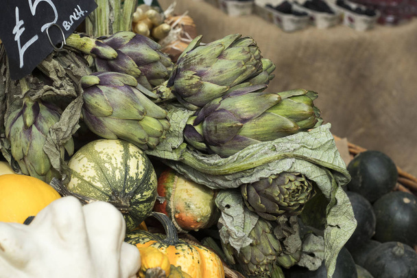 various types of pumpkins and zucchini in a wicker basket at Borough Market - 写真・画像