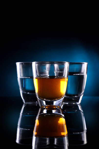 Three Shot glasses with alcohol drinks - Photo, Image