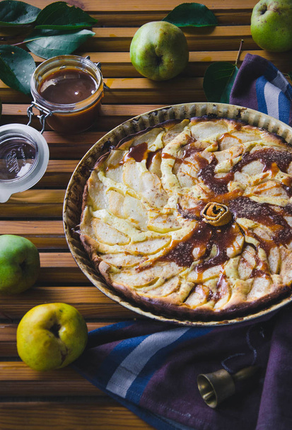 Pear pie with nuts and mascarpone on a wooden background - Φωτογραφία, εικόνα