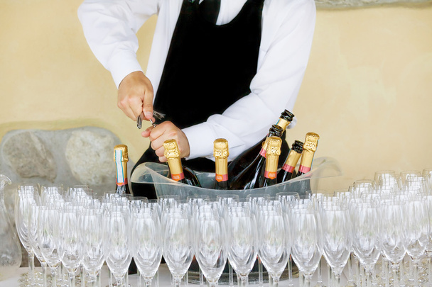 waiter opening a bottle of white wine - Photo, Image