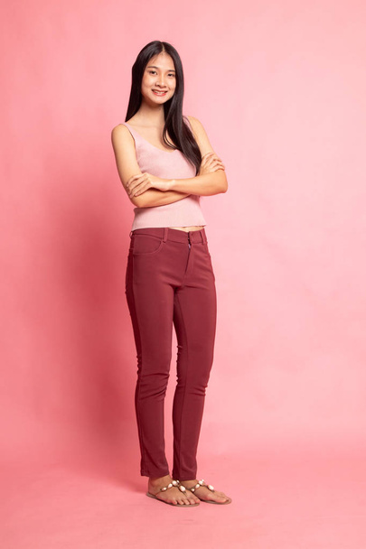 Full body of beautiful young asian woman on pink background - Фото, зображення