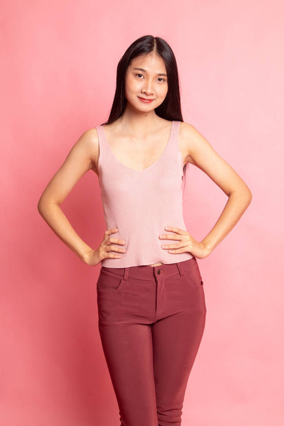 Portrait of beautiful young Asian woman on pink background - Fotografie, Obrázek