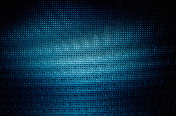 Op een donker blauwe achtergrond naar een punt een volumetrische wolk van licht - Foto, afbeelding