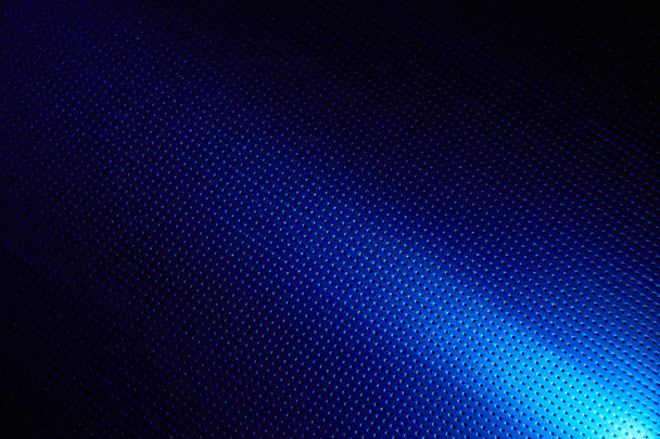 Diagonal bright beam of light on a blue background to the point - Photo, Image