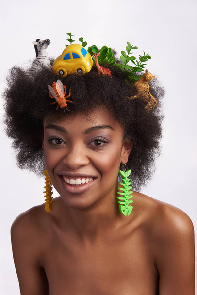 Smiling young ethnic female in safari hairstyle - Foto, Imagen