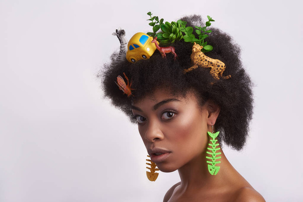 Portrait of ethnic shy lady with odd hairstyle - Foto, imagen