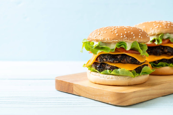 homemade and fresh tasty burger with cheese - Фото, зображення