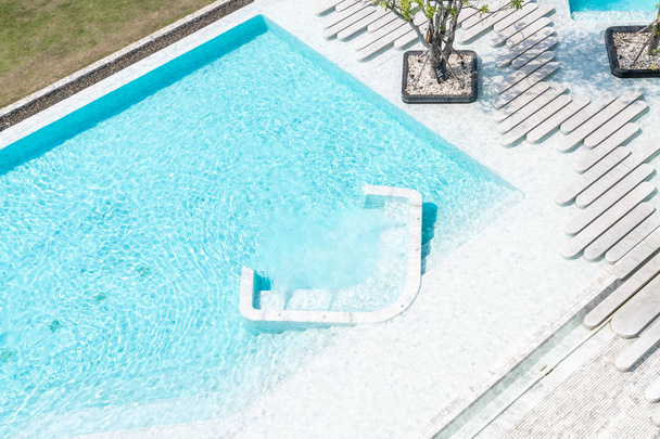 Aerial view of Beautiful luxury hotel swimming pool resort with walk way - Fotó, kép