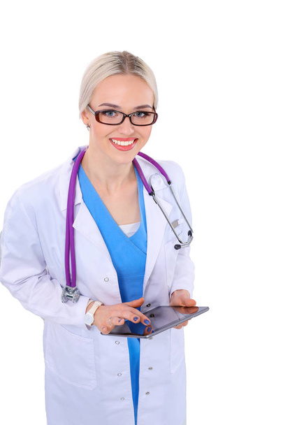 Female doctor using a digital tablet and standing on white background. Woman doctors. - Foto, afbeelding