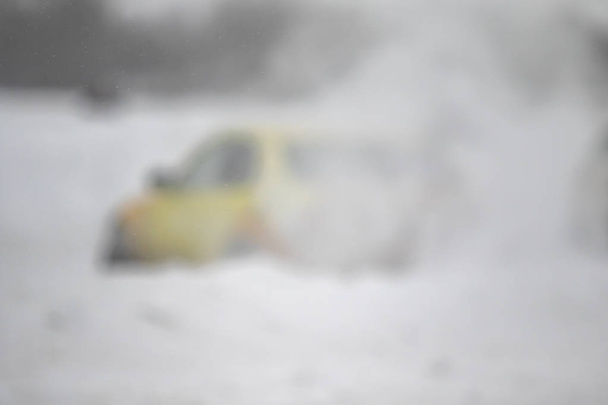 passenger car in winter snow blizzard, ice icy road - Foto, imagen