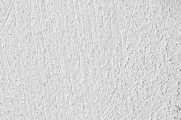 Textura de fondo.Muro de hormigón blanco. Pequeñas grietas en la superficie
. - Foto, Imagen
