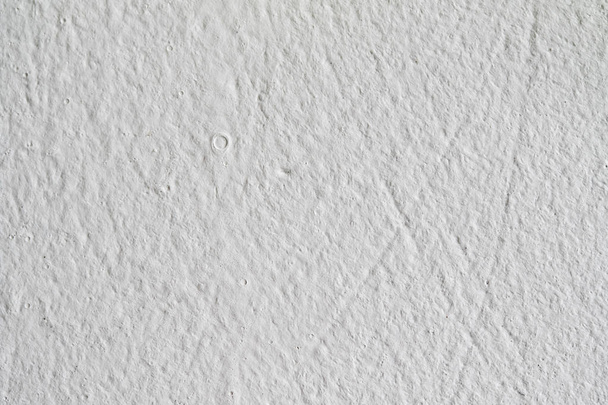 Background texture.White concrete wall. Small cracks on the surface. - Foto, Imagem