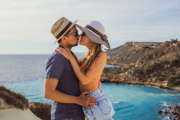Couple embrace and kissing in the day on the seaside, beautiful view to sea - Photo, Image