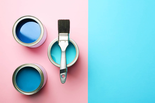 Open paint cans, brush and space for text on color background, top view - Fotoğraf, Görsel