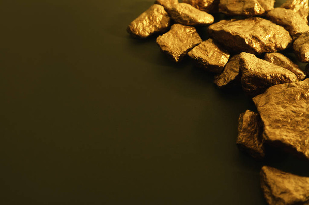 Pile of gold nuggets on color background. Space for text - Fotografie, Obrázek