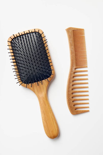 Bamboo Comb and Hairbrush On White Background - Foto, Imagen