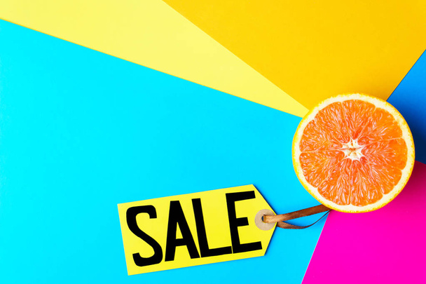 summer vacation sale, price tag and half of orange - Фото, изображение