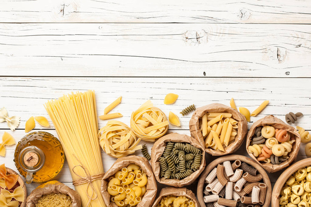 Assortment of pasta on a wooden table - Foto, imagen