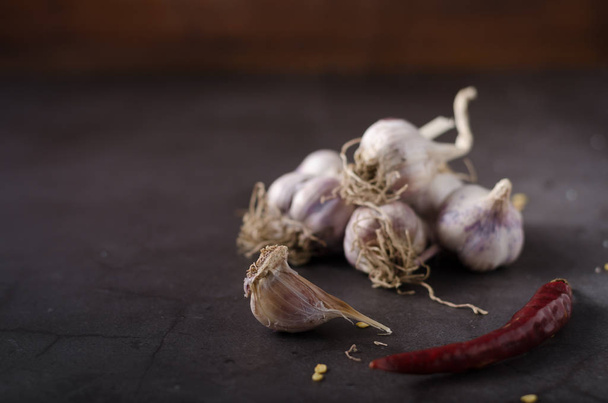 Bio garlic from garden, organic garlic on dark background - Photo, image