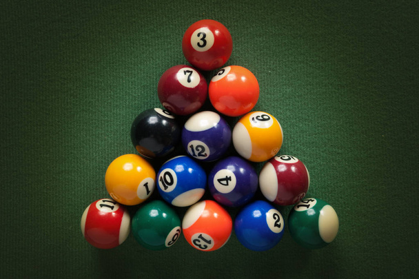 billiard table with green material and billiard balls - Fotografie, Obrázek