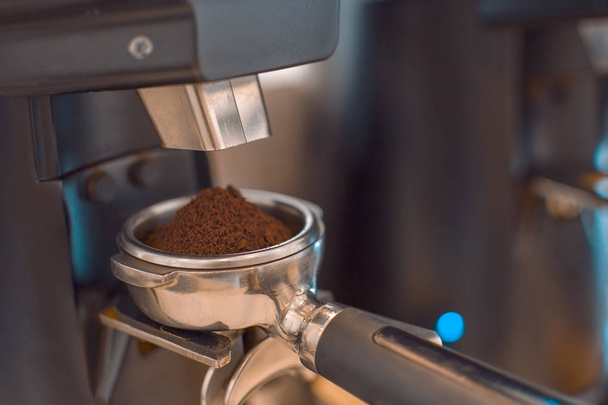 Barista grinding coffee ready for perfect cup of espresso - Photo, Image