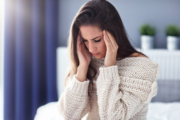 Adult woman suffering from headache at home - Fotografie, Obrázek