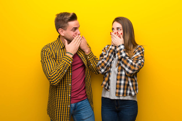 Couple in valentine day covering mouth with hands - Фото, зображення