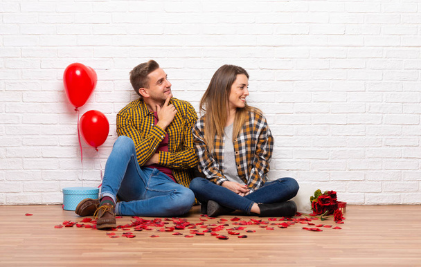 Couple in valentine day at indoors looking to the side - Photo, Image