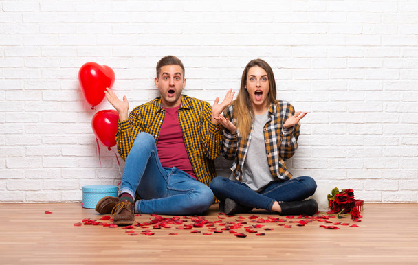 Couple in valentine day at indoors with surprise and shocked facial expression - Photo, Image