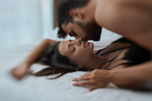 Sexy lovers in passion - Loving couple in bed having sex - Φωτογραφία, εικόνα
