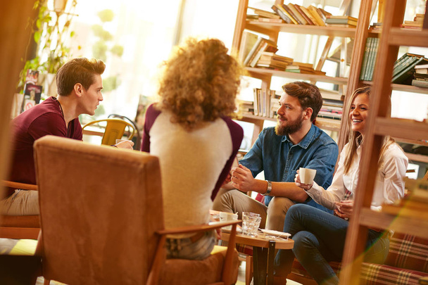 Group of students talking and drink coffee in cafeteria  - Photo, Image