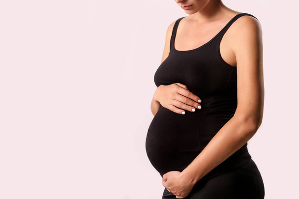 Pregnant woman belly - studio shot - Φωτογραφία, εικόνα