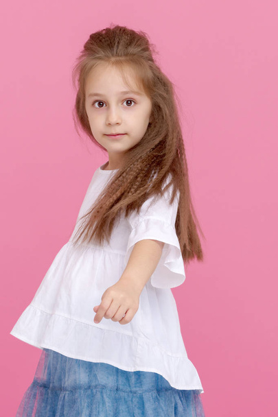 Beautiful little girl close-up. The concept of beauty and fashion, happy childhood.  - Foto, Imagen