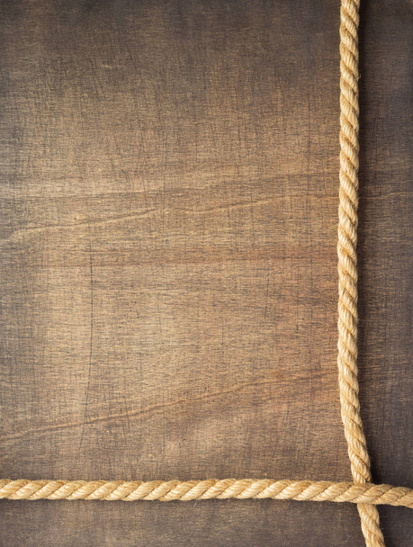 ship rope at wooden background surface - Фото, зображення