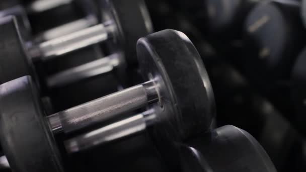 Set, a rack of dumbbells of different sizen for training, close-up. - Footage, Video