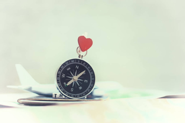 Time to Travel. Idea for tourism with an airplane, passport and tickets and compass with heart on a light background. Concept on the theme of flights - 写真・画像