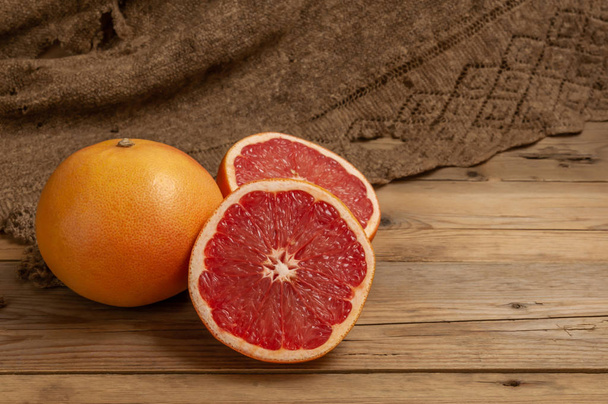 citrus grapefruits on a wooden Board and an old grandma's handkerchief - 写真・画像