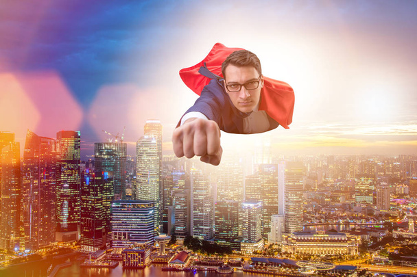 Superhero businessman flying over the city - Photo, Image