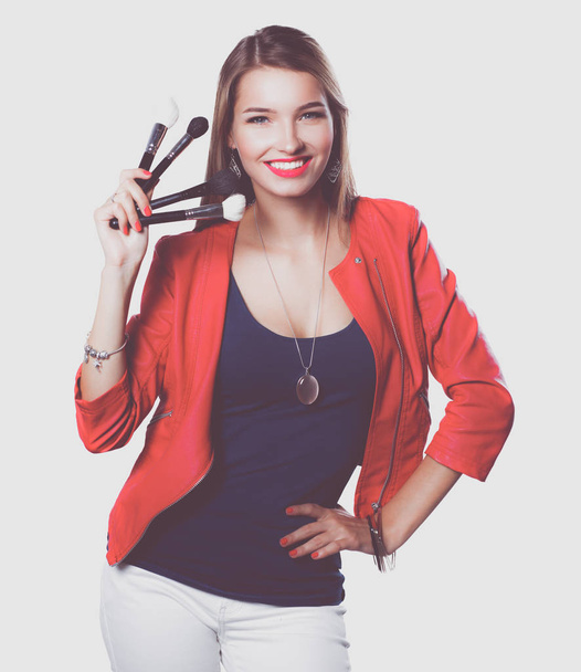 Young beautiful woman holds in hand brush for makeup . - Valokuva, kuva