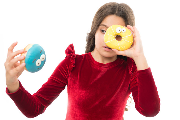 Kid girl hungry for sweet donut. Sugar levels and healthy nutrition. Donut her sweet obsession. Happy childhood and sweet treats. Donut breaking diet concept. Girl hold glazed donut white background - Fotó, kép