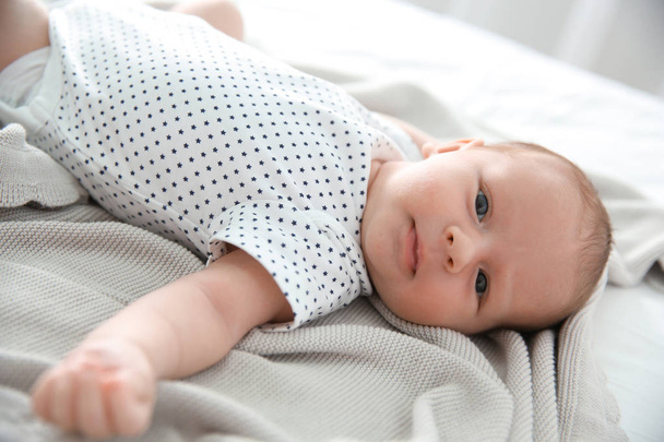 Adorable newborn baby peacefully sleeping on bed - Valokuva, kuva